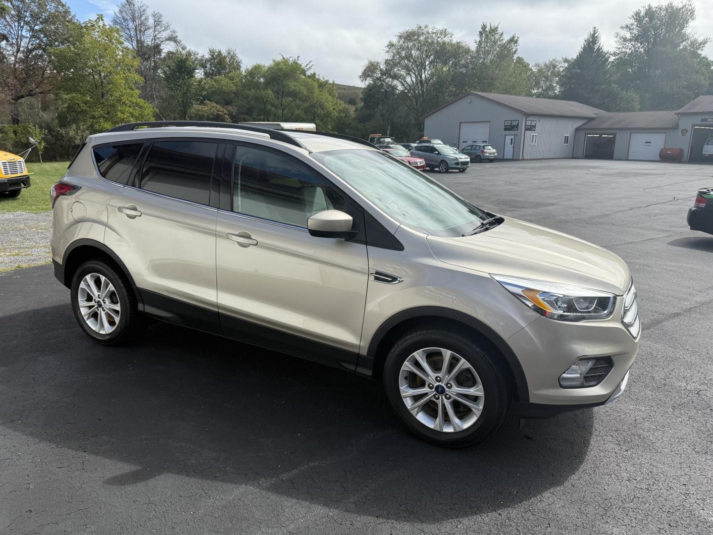 2017 Beige Ford Escape SE 4WD (1FMCU9GD2HU) with an 1.5L L4 DOHC 16V engine, 6A transmission, located at 8464 Route 219, Brockway, PA, 15824, (814) 265-1330, 41.226871, -78.780518 - One sharp pre owned Ford Escape SE 4-wheel drive with air condition, power windows and locks, power seat, pano-roof, factory alloys, and only 53,000 miles. This Ford is serviced, Pa-inspected. Stop in or call one of the Morelli brothers today on this nice suv. - Photo#20