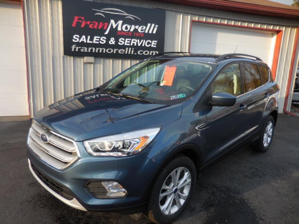 2018 Blue Ford Escape SEL 4WD (1FMCU9HD6JU) with an 1.5L L4 DOHC 16V engine, 6A transmission, located at 8464 Route 219, Brockway, PA, 15824, (814) 265-1330, 41.226871, -78.780518 - Photo #0