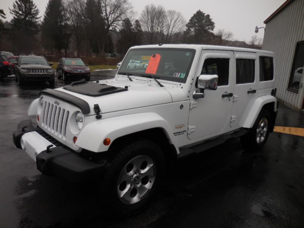 2013 White Jeep Wrangler Unlimited Sahara 4WD (1C4BJWEG1DL) with an 3.6L V6 DOHC 24V FFV engine, located at 8464 Route 219, Brockway, PA, 15824, (814) 265-1330, 41.226871, -78.780518 - Photo #0