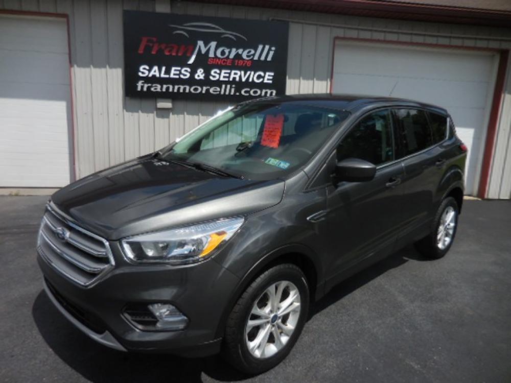 2017 Gray Ford Escape SE 4WD (1FMCU9GD4HU) with an 1.5L L4 DOHC 16V engine, 6A transmission, located at 8464 Route 219, Brockway, PA, 15824, (814) 265-1330, 41.226871, -78.780518 - Photo #0