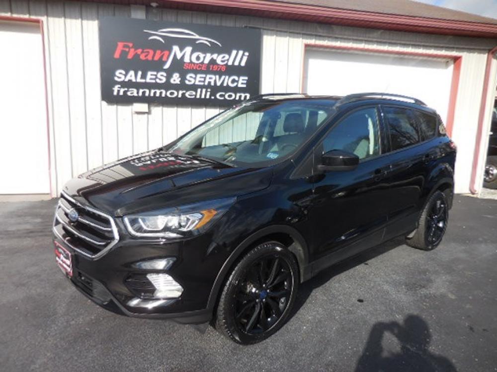 2017 Black Ford Escape SE 4WD (1FMCU9GDXHU) with an 1.5L L4 DOHC 16V engine, 6A transmission, located at 8464 Route 219, Brockway, PA, 15824, (814) 265-1330, 41.226871, -78.780518 - Photo #0