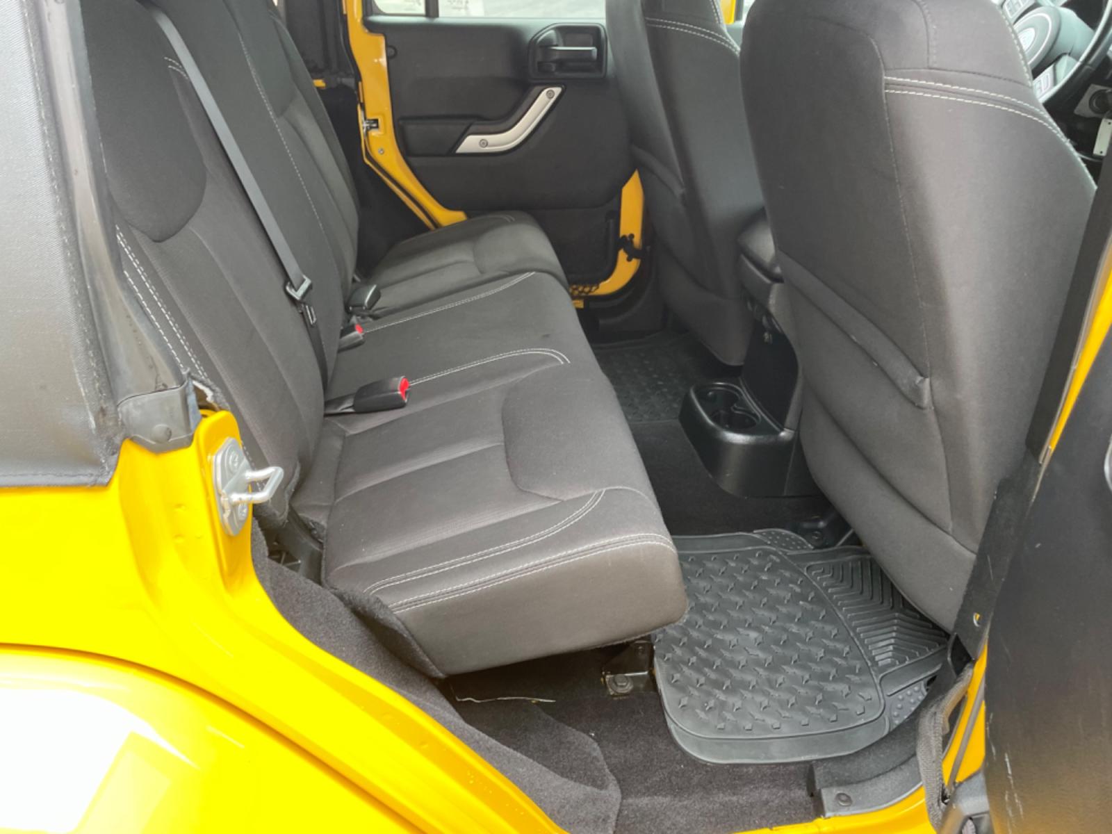 2015 Yellow Jeep Wrangler Unlimited Sahara 4WD (1C4BJWEGXFL) with an 3.6L V6 DOHC 24V FFV engine, 6sp transmission, located at 8464 Route 219, Brockway, PA, 15824, (814) 265-1330, 41.226871, -78.780518 - Photo #15