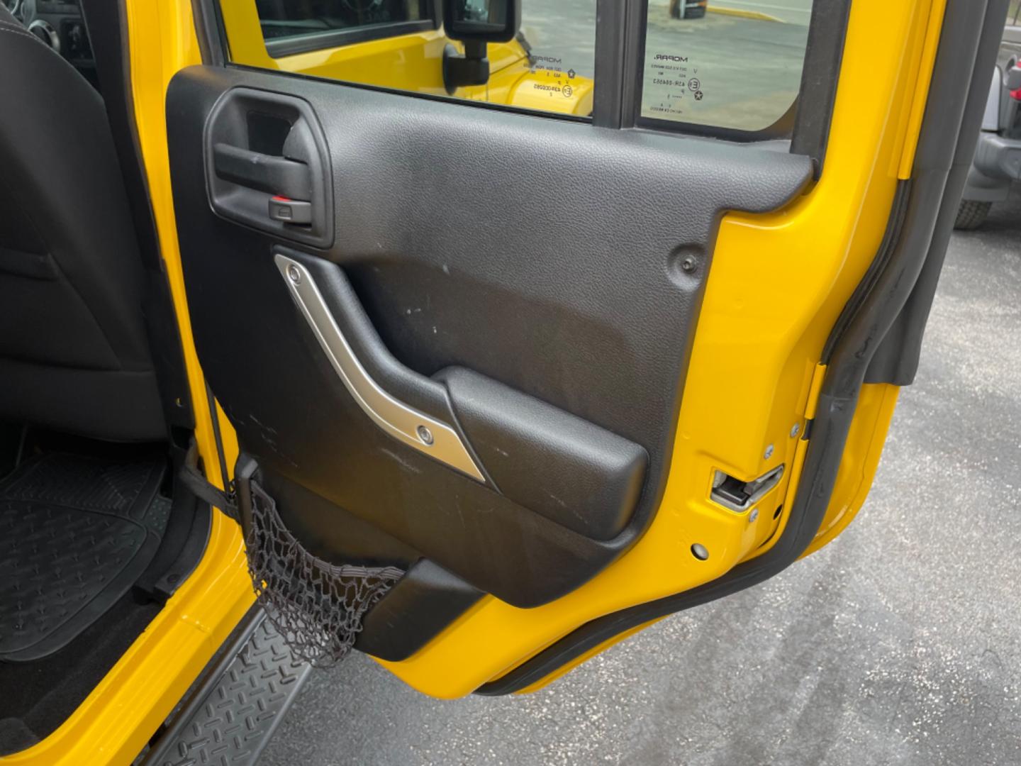 2015 Yellow Jeep Wrangler Unlimited Sahara 4WD (1C4BJWEGXFL) with an 3.6L V6 DOHC 24V FFV engine, 6sp transmission, located at 8464 Route 219, Brockway, PA, 15824, (814) 265-1330, 41.226871, -78.780518 - Photo#16