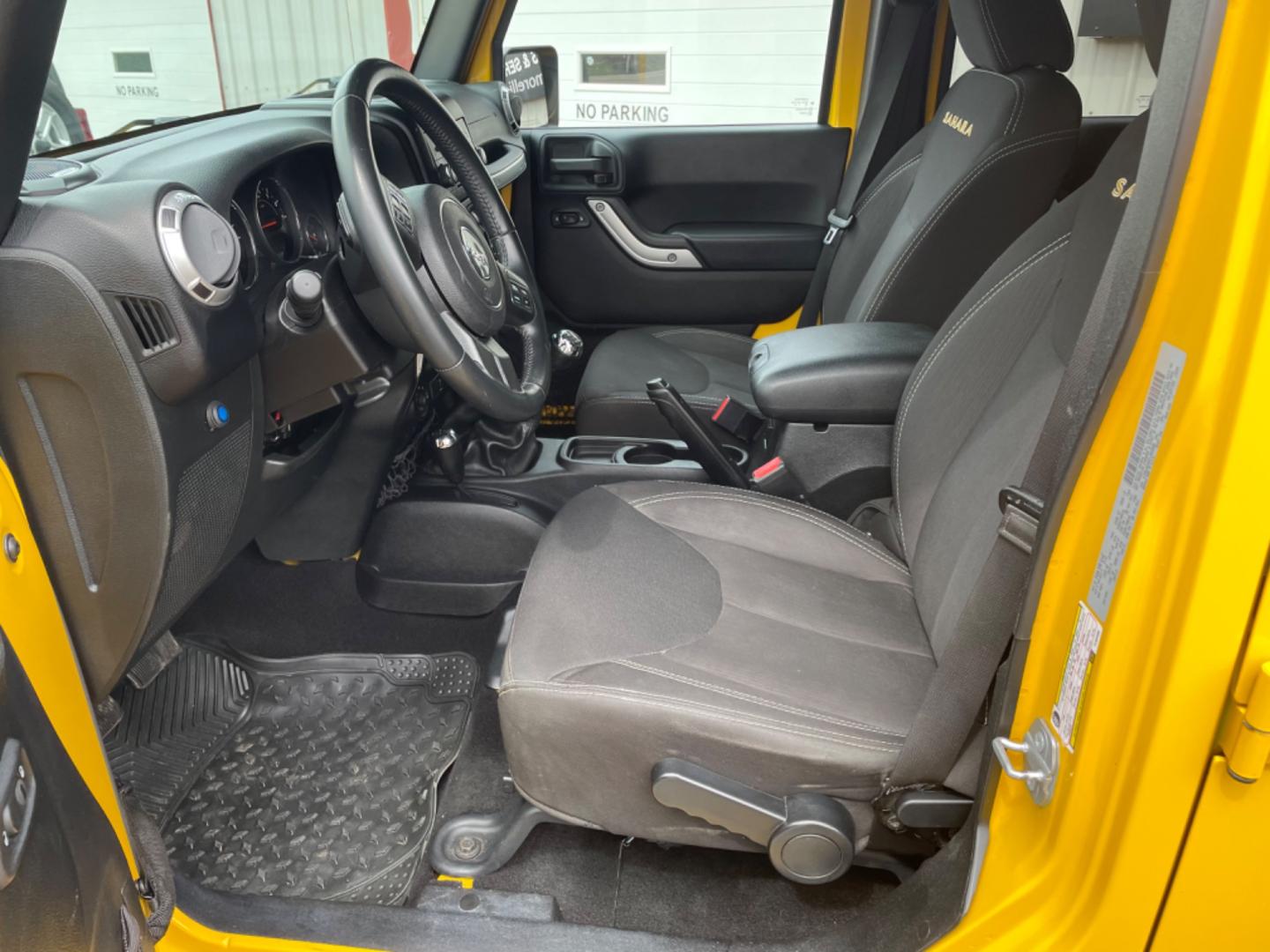 2015 Yellow Jeep Wrangler Unlimited Sahara 4WD (1C4BJWEGXFL) with an 3.6L V6 DOHC 24V FFV engine, 6sp transmission, located at 8464 Route 219, Brockway, PA, 15824, (814) 265-1330, 41.226871, -78.780518 - MUST SEE 2015 JEEP WRANGLER UNLIMITED SAHARA 4WD WITH LIFT AND CHROME WHEELS. This pre owned Jeep has ONLY 47000 miles and comes with a soft top, air condition, 6sp manual transmission, power windows and locks, and much more. Serviced and Pa-inspected. - Photo#4