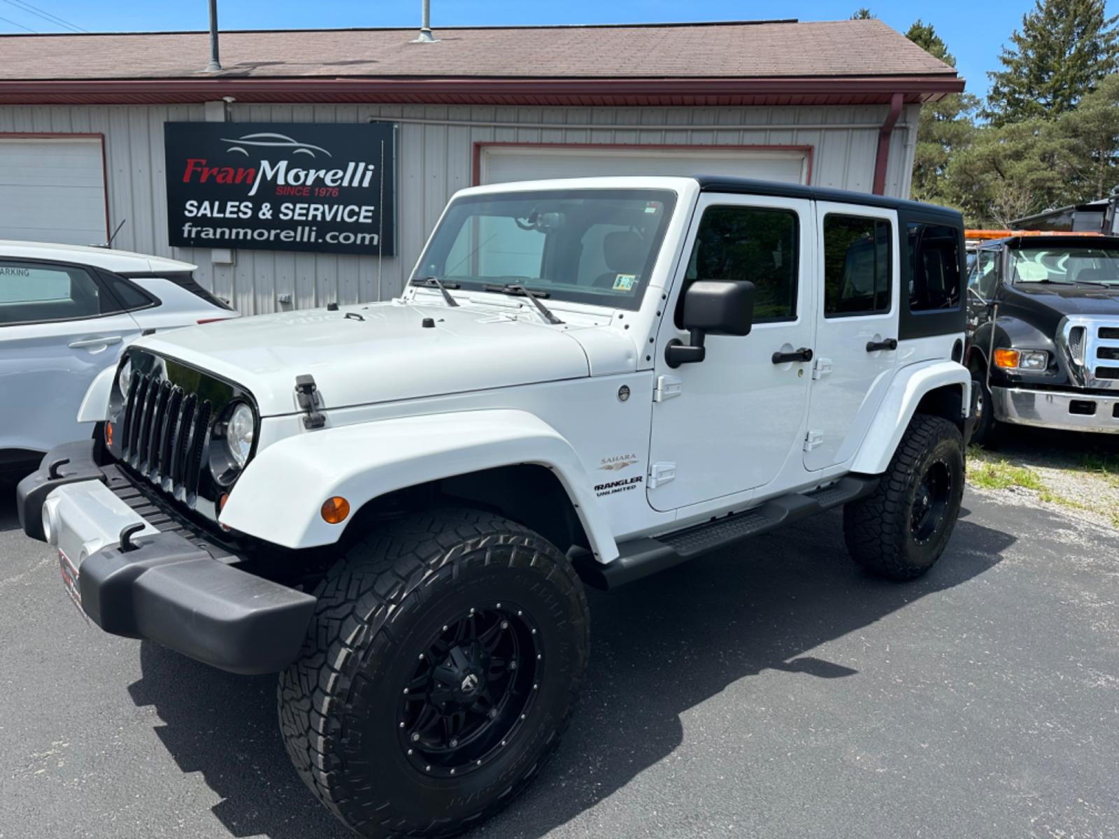 2013 White Jeep Wrangler Unlimited Sahara 4WD (1C4BJWEG2DL) with an 3.6L V6 DOHC 24V FFV engine, located at 8464 Route 219, Brockway, PA, 15824, (814) 265-1330, 41.226871, -78.780518 - Photo #0
