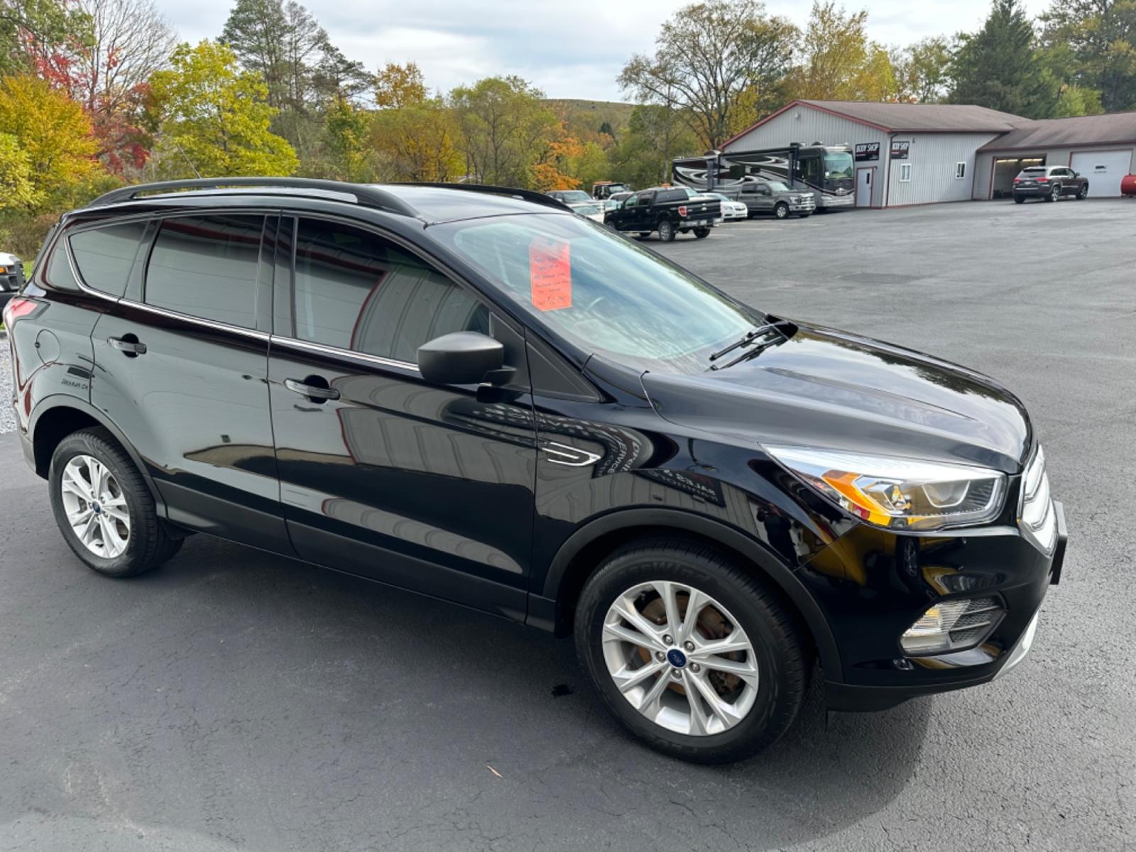 2018 Black Ford Escape SEL 4WD (1FMCU9HD6JU) with an 1.5L L4 DOHC 16V engine, 6A transmission, located at 8464 Route 219, Brockway, PA, 15824, (814) 265-1330, 41.226871, -78.780518 - Good looking pre owned 2018 Ford Escape SEL well equipped with leather, power/heated seats, factory alloys and more. Serviced, new tires, and comes with a 12 month/12000 mile warranty. Priced to sell so hurry in before your too late. - Photo #18