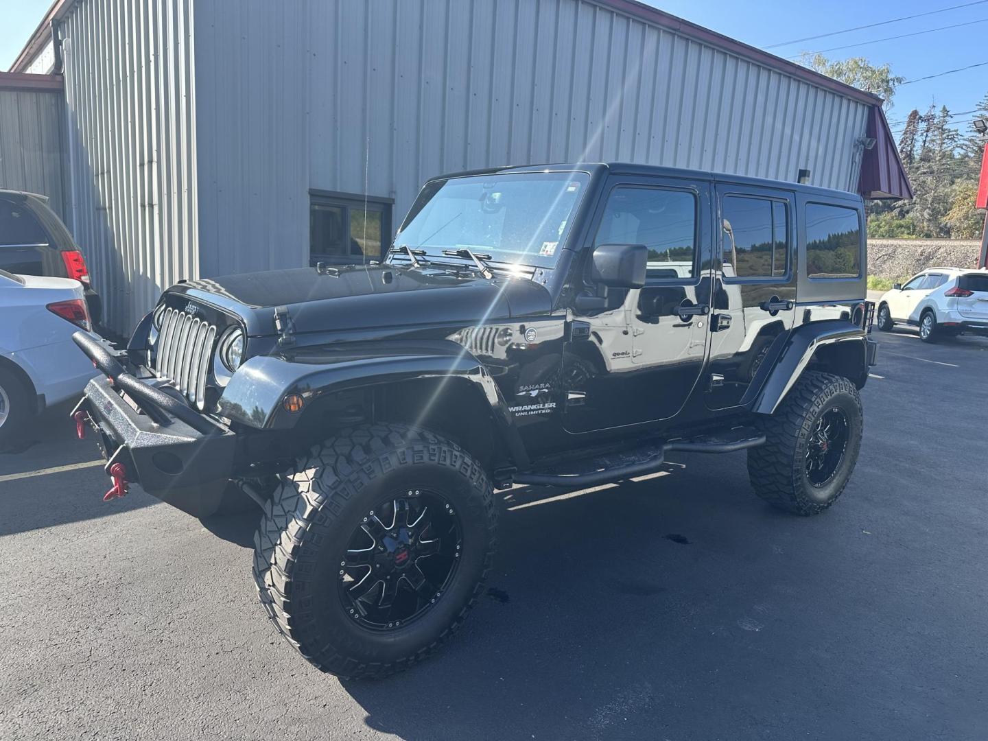 2016 Black Jeep Wrangler Unlimited Sahara 4WD (1C4BJWEGXGL) with an 3.6L V6 DOHC 24V FFV engine, located at 8464 Route 219, Brockway, PA, 15824, (814) 265-1330, 41.226871, -78.780518 - Photo#0