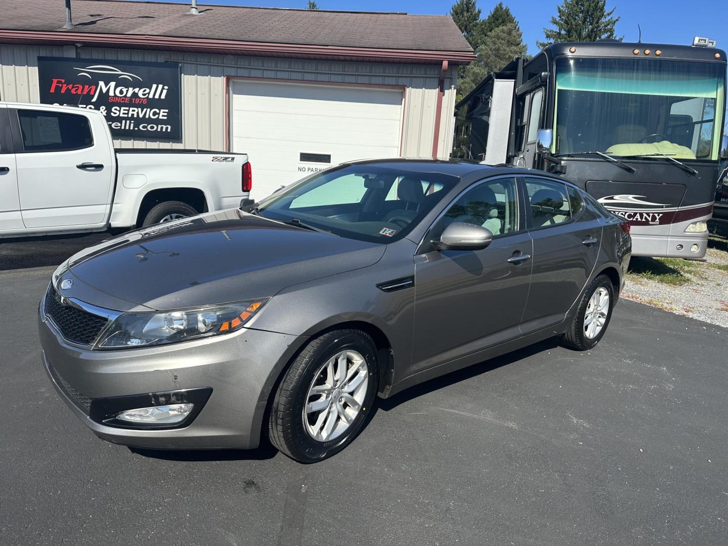 2013 Brown Kia Optima LX MT (5XXGM4A7XDG) with an 2.4L L4 DOHC 16V engine, 5-Speed Manual transmission, located at 8464 Route 219, Brockway, PA, 15824, (814) 265-1330, 41.226871, -78.780518 - Photo#0