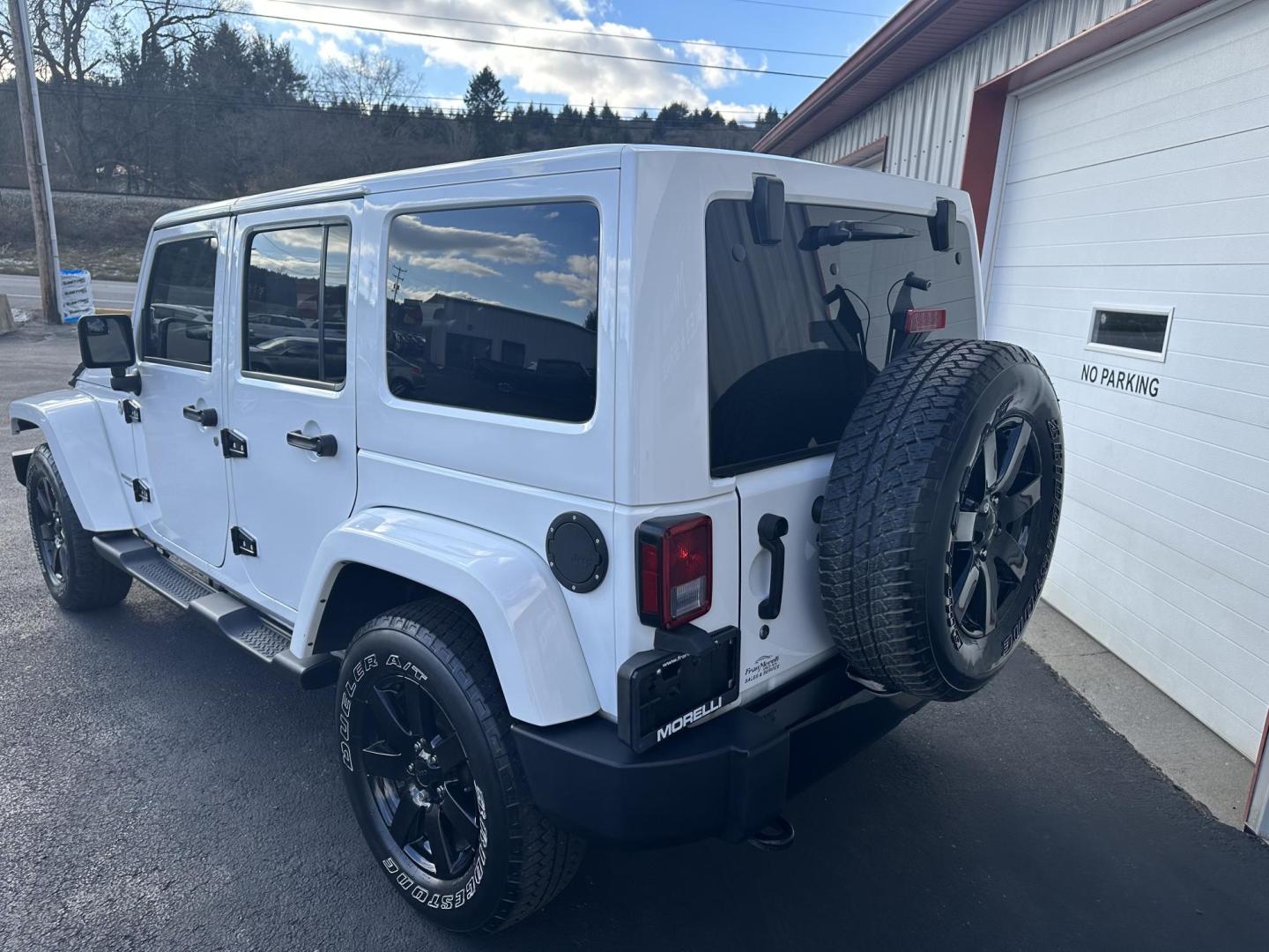 2014 White Jeep Wrangler Unlimited Sahara 4WD (1C4HJWEGXEL) with an 3.6L V6 DOHC 24V FFV engine, located at 8464 Route 219, Brockway, PA, 15824, (814) 265-1330, 41.226871, -78.780518 - Local owner well taken care of and serviced at our dealership. This Jeep Wrangler was bought originally from here and serviced up. 2014 Jeep Wrangler Unlimited Altitude package with V6, leather interior, matching hard top, back up camera and much more. Blacked out wheels, serviced and ready to go. - Photo#8