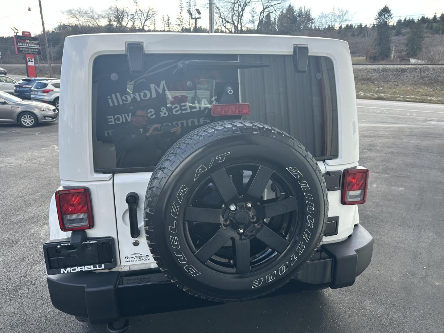 2014 White Jeep Wrangler Unlimited Sahara 4WD (1C4HJWEGXEL) with an 3.6L V6 DOHC 24V FFV engine, located at 8464 Route 219, Brockway, PA, 15824, (814) 265-1330, 41.226871, -78.780518 - Local owner well taken care of and serviced at our dealership. This Jeep Wrangler was bought originally from here and serviced up. 2014 Jeep Wrangler Unlimited Altitude package with V6, leather interior, matching hard top, back up camera and much more. Blacked out wheels, serviced and ready to go. - Photo#7