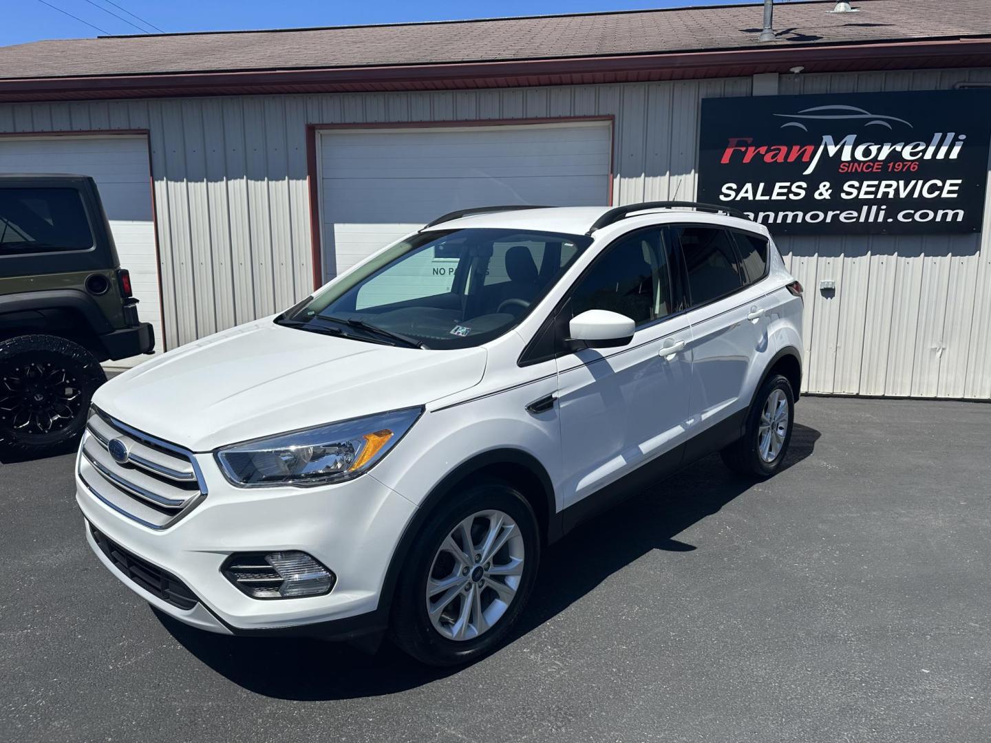 2018 White Ford Escape SE 4WD (1FMCU9GD8JU) with an 1.5L L4 DOHC 16V engine, 6A transmission, located at 8464 Route 219, Brockway, PA, 15824, (814) 265-1330, 41.226871, -78.780518 - ONLY 30,000 MILES ON THE PRE OWNED 2018 FORD ESCAPE SE 4WD with automatic transmission, air condition, power windows and locks, power/heated front seats, factory alloy wheels and much more. This Ford suv is serviced, Pa-inspected with new tires, and comes with a warranty. - Photo#0