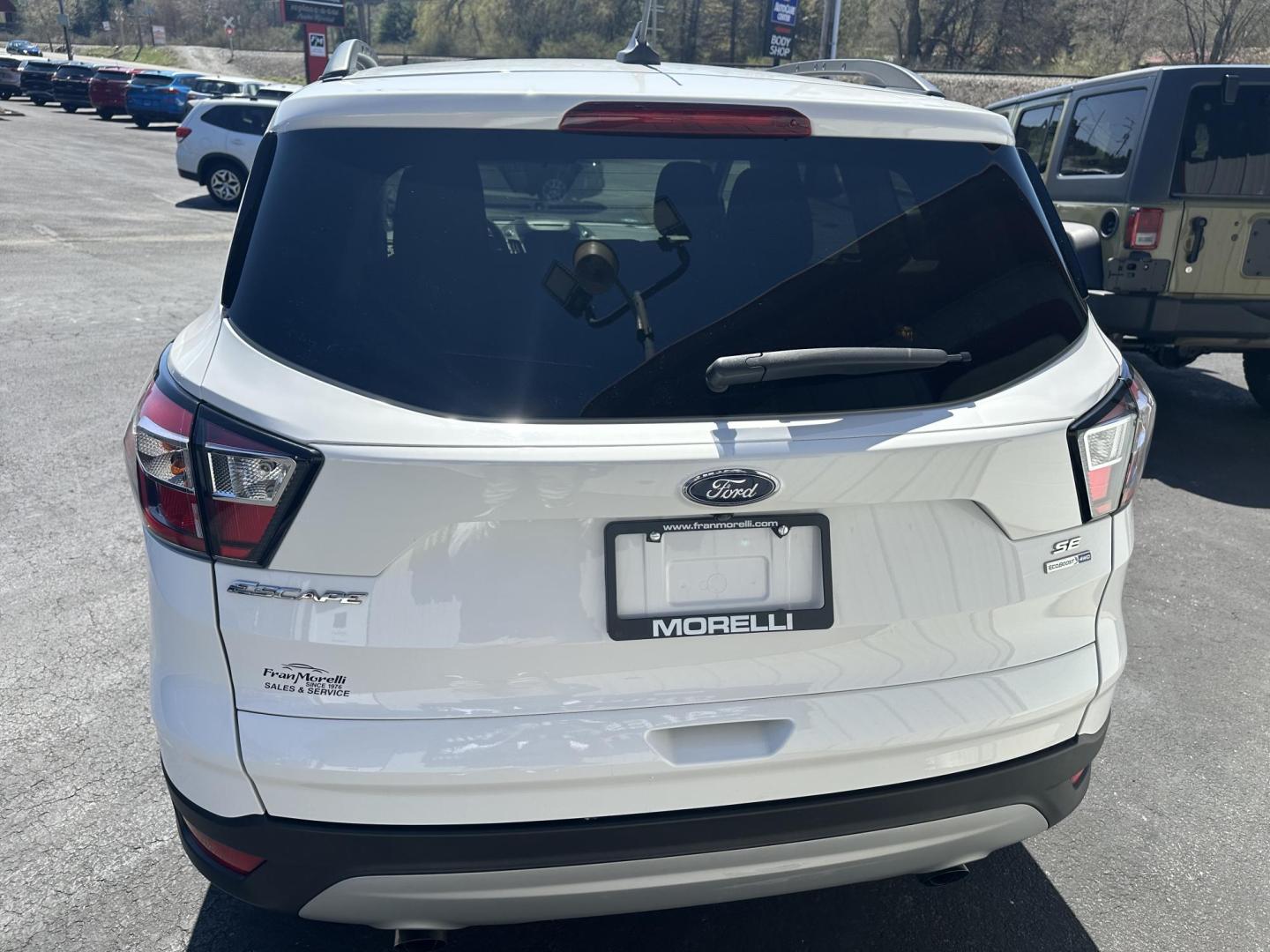 2018 White Ford Escape SE 4WD (1FMCU9GD8JU) with an 1.5L L4 DOHC 16V engine, 6A transmission, located at 8464 Route 219, Brockway, PA, 15824, (814) 265-1330, 41.226871, -78.780518 - ONLY 30,000 MILES ON THE PRE OWNED 2018 FORD ESCAPE SE 4WD with automatic transmission, air condition, power windows and locks, power/heated front seats, factory alloy wheels and much more. This Ford suv is serviced, Pa-inspected with new tires, and comes with a warranty. - Photo#11
