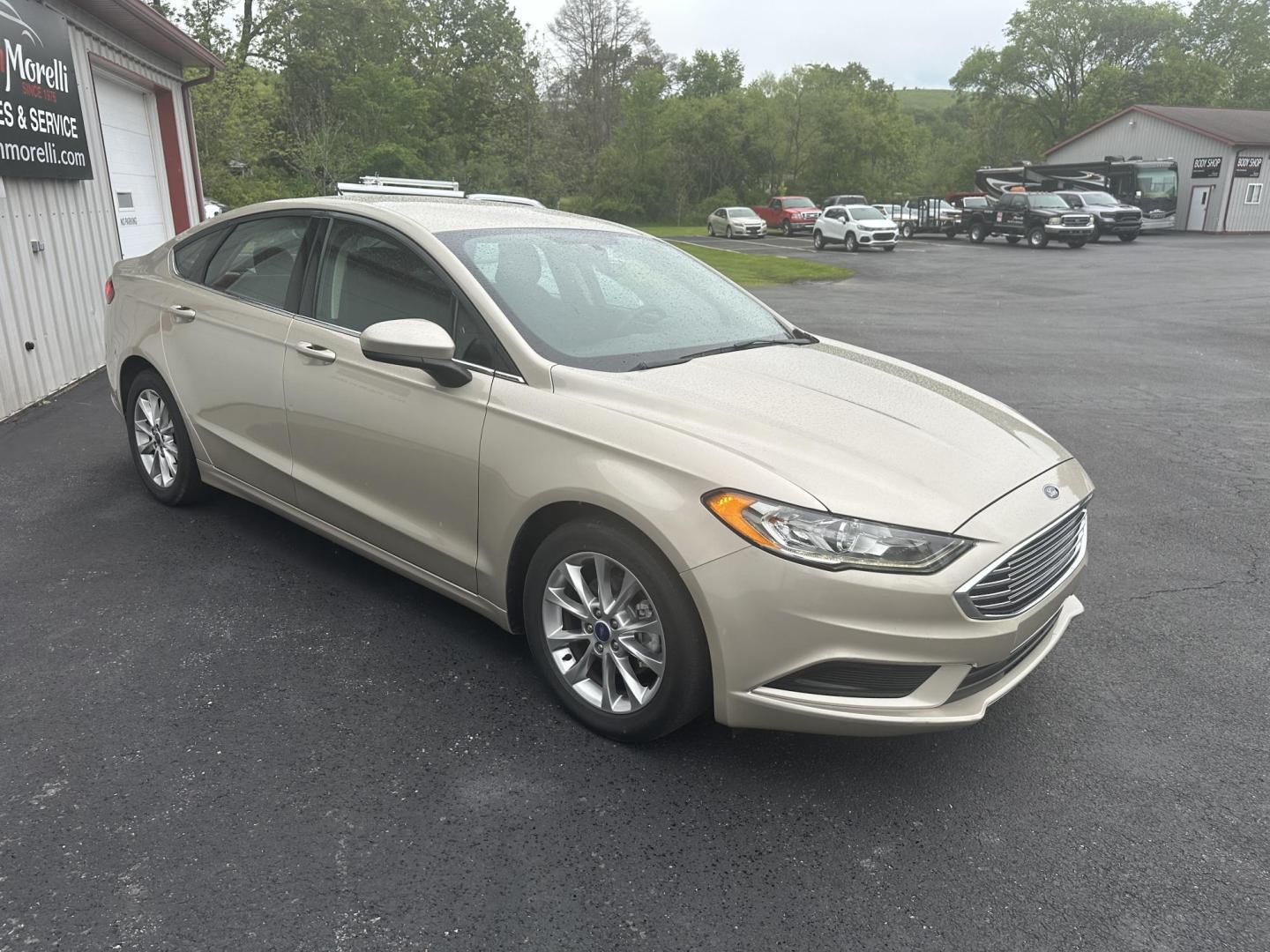 2017 Gold Ford Fusion SE (3FA6P0H78HR) with an 2.5L L4 DOHC 16V engine, 6A transmission, located at 8464 Route 219, Brockway, PA, 15824, (814) 265-1330, 41.226871, -78.780518 - Clean, well taken care of 2017 Ford Fusion SE with only 62,000 miles. This Ford Sedan is well equipped with automatic transmission, air condition, power windows and locks, power seat and factory wheels. Serviced up and ready to go. - Photo#16