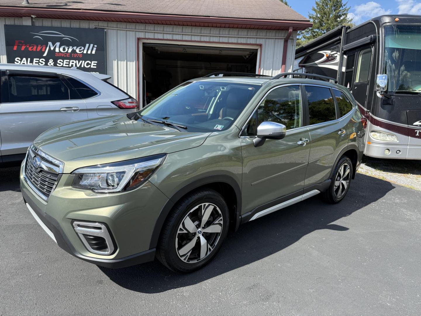 2019 Green Subaru Forester Touring (JF2SKAWC8KH) with an 2.5L H4 SOHC 16V engine, CVT transmission, located at 8464 Route 219, Brockway, PA, 15824, (814) 265-1330, 41.226871, -78.780518 - ONE SHARP LOCAL TRADE IN and in very nice condition. 2019 Subaru Forester Touring pkg with leather interior, power pano roof, navigation, pwr/heated front seats, and much more. This Subaru has only 48000 miles and is serviced up. - Photo#0