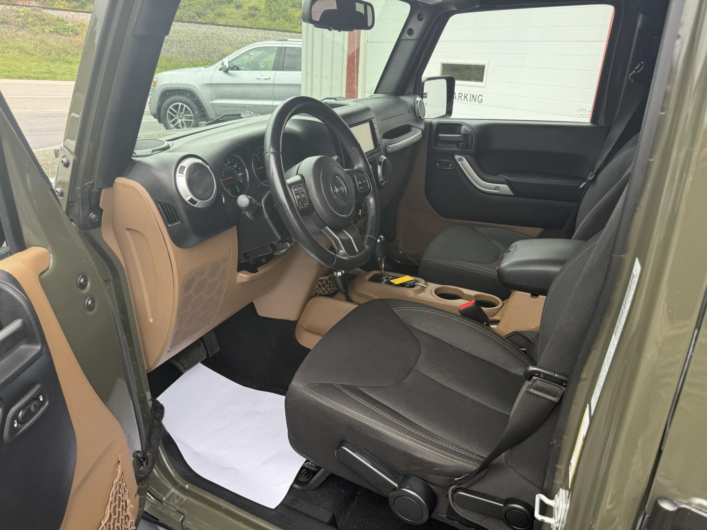 2015 Green Jeep Wrangler Unlimited Sahara 4WD (1C4BJWEG8FL) with an 3.6L V6 DOHC 24V FFV engine, located at 8464 Route 219, Brockway, PA, 15824, (814) 265-1330, 41.226871, -78.780518 - Clean, well taken care of 2015 Jeep Wrangler Unlimited Sahara with 4wd, V6, automatic transmission, air condition, power windows and locks, soft top and good miles. This Jeep is serviced up and ready to go.- Photo#1