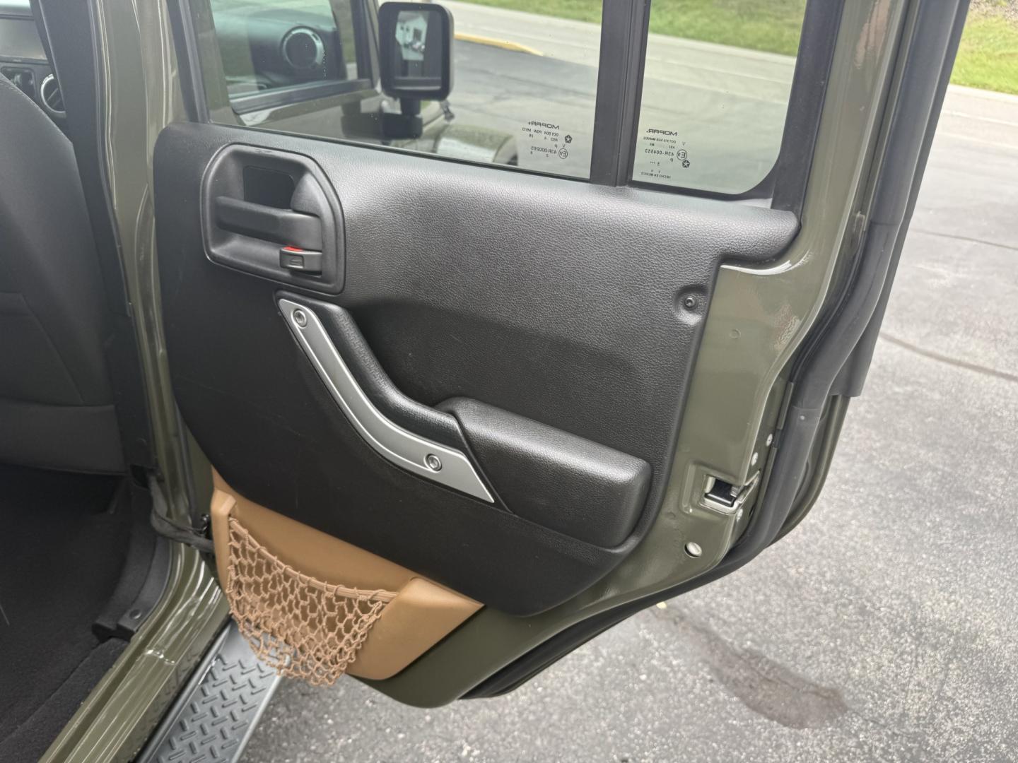 2015 Green Jeep Wrangler Unlimited Sahara 4WD (1C4BJWEG8FL) with an 3.6L V6 DOHC 24V FFV engine, located at 8464 Route 219, Brockway, PA, 15824, (814) 265-1330, 41.226871, -78.780518 - Clean, well taken care of 2015 Jeep Wrangler Unlimited Sahara with 4wd, V6, automatic transmission, air condition, power windows and locks, soft top and good miles. This Jeep is serviced up and ready to go.- Photo#11